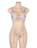 Purple floral embroidered lingerie set with underwire bra, adjustable straps, sheer mesh, garters, and leg loops