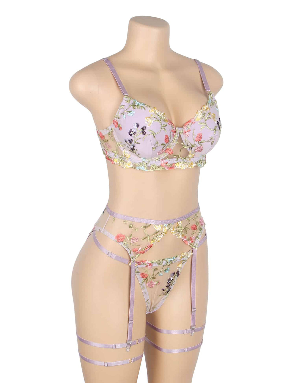 Angled view of lavender floral mesh lingerie with underwire support, adjustable waistband, garters, and leg straps