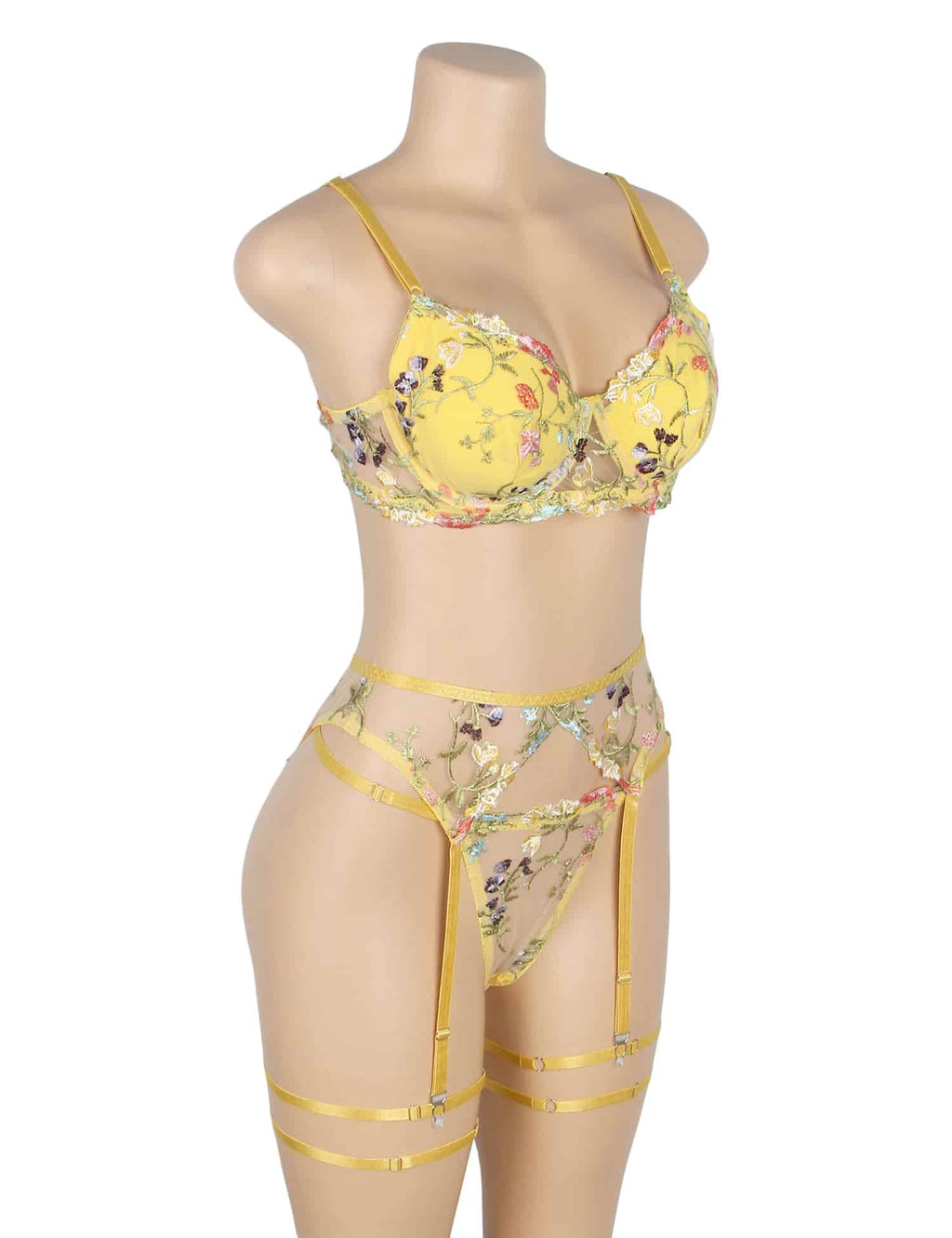 Angled view of yellow floral mesh lingerie with underwire support, adjustable waistband, garters, and leg straps