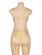 Back view of canary yellow floral sexy lingerie set with adjustable hook closure, sheer mesh briefs, garters, and leg loops