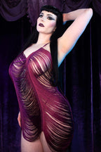 Model wearing Desiree, a burgundy tassel stripper dress that accents the booty immeasurably