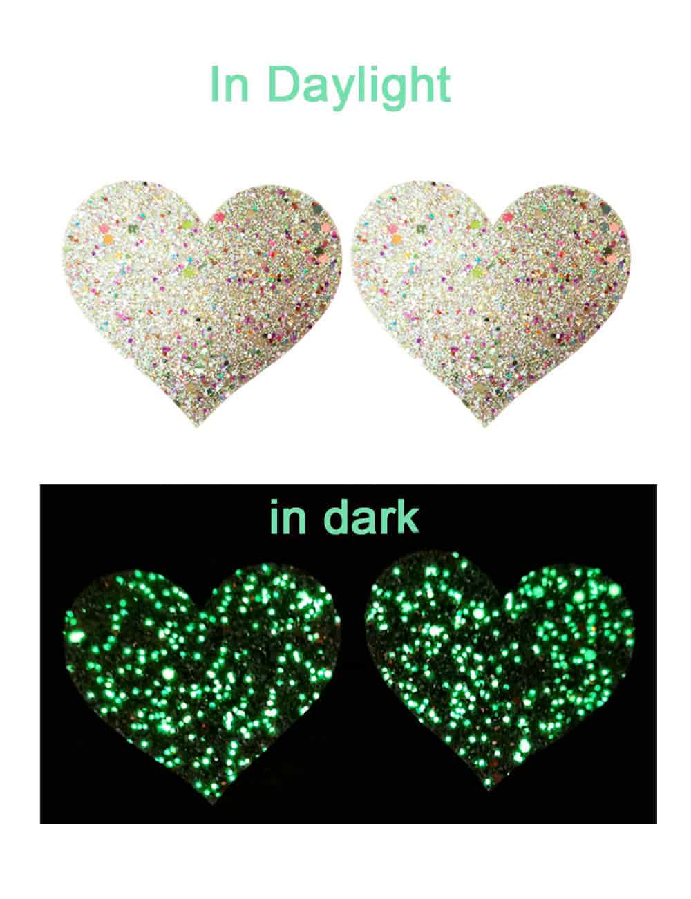 Heart-shaped pasties with glittery finish on a white background, showing 'In Daylight' and 'In Dark' text.